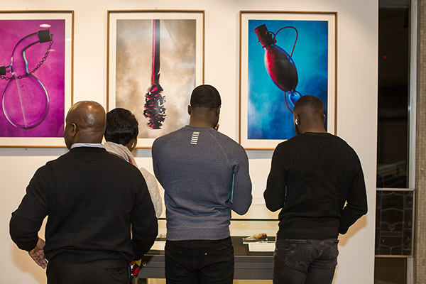 Visitors explore Unfamiliar exhibition.