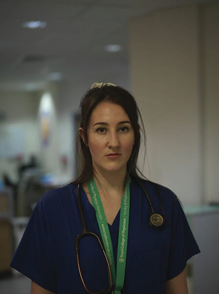 Portrait of Physician Associate wearing scrubs.