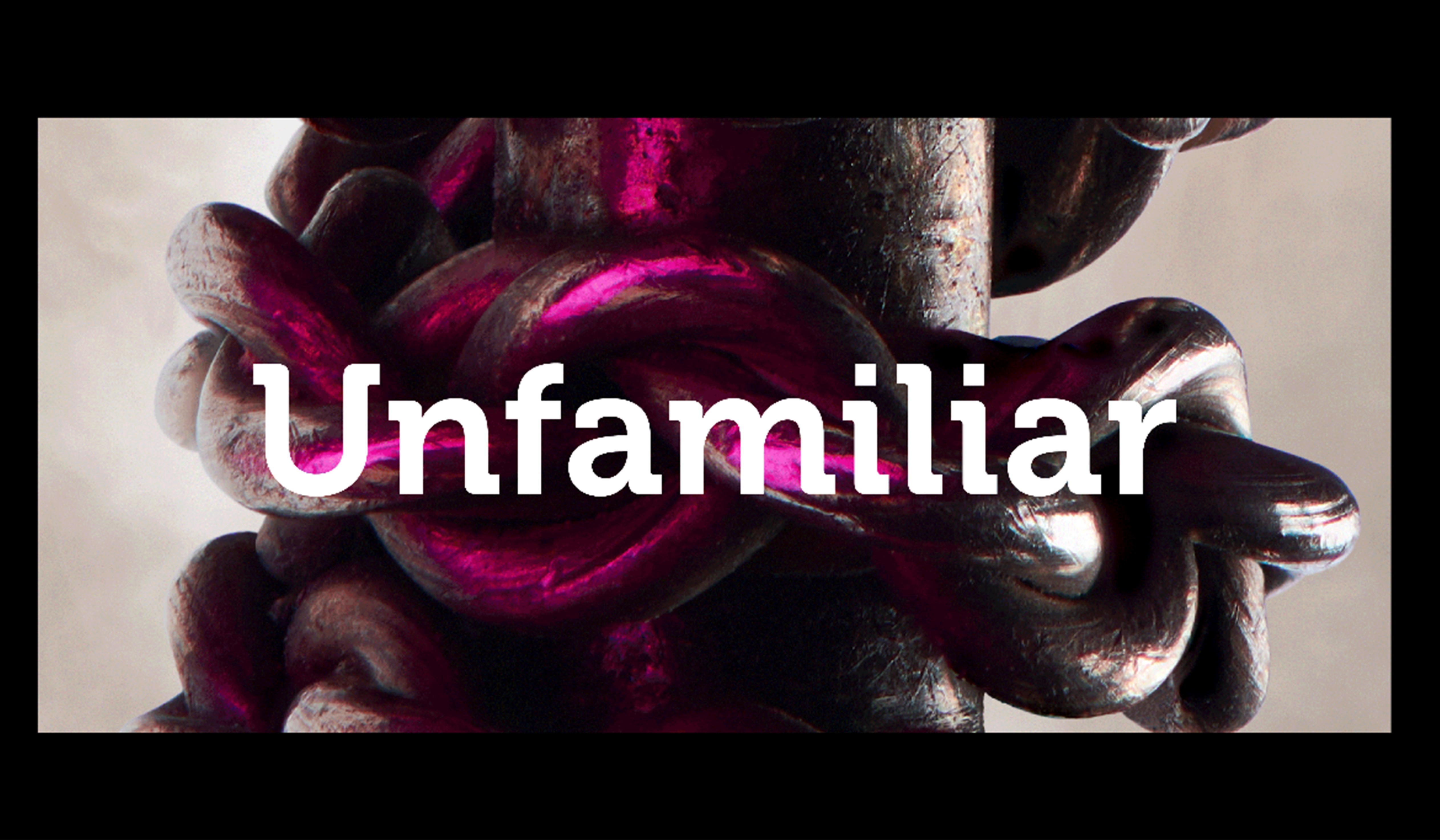 Exhibition graphic for Unfamiliar showing artwork by Theo Deproost showing a chain wound round a metal shaft.