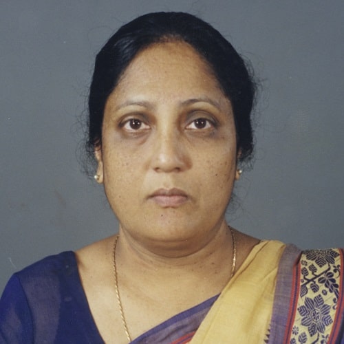 A head and shoulders photograph of Doctor Buddhika wearing a purple sari