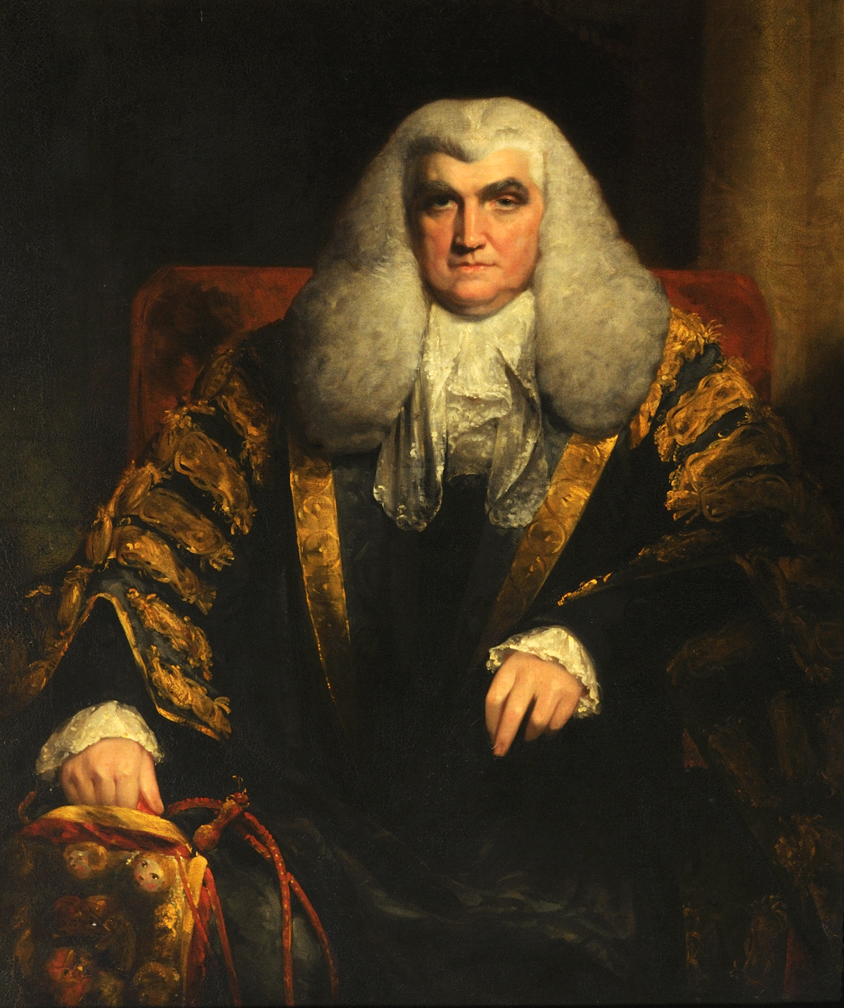 Oil painting of an 18th century man wearing wig and robes.
