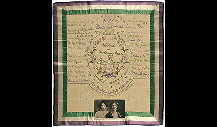 Embroidered handkerchief with a portrait photograph of two women at the bottom