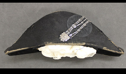 Photograph of a black bicorn hat