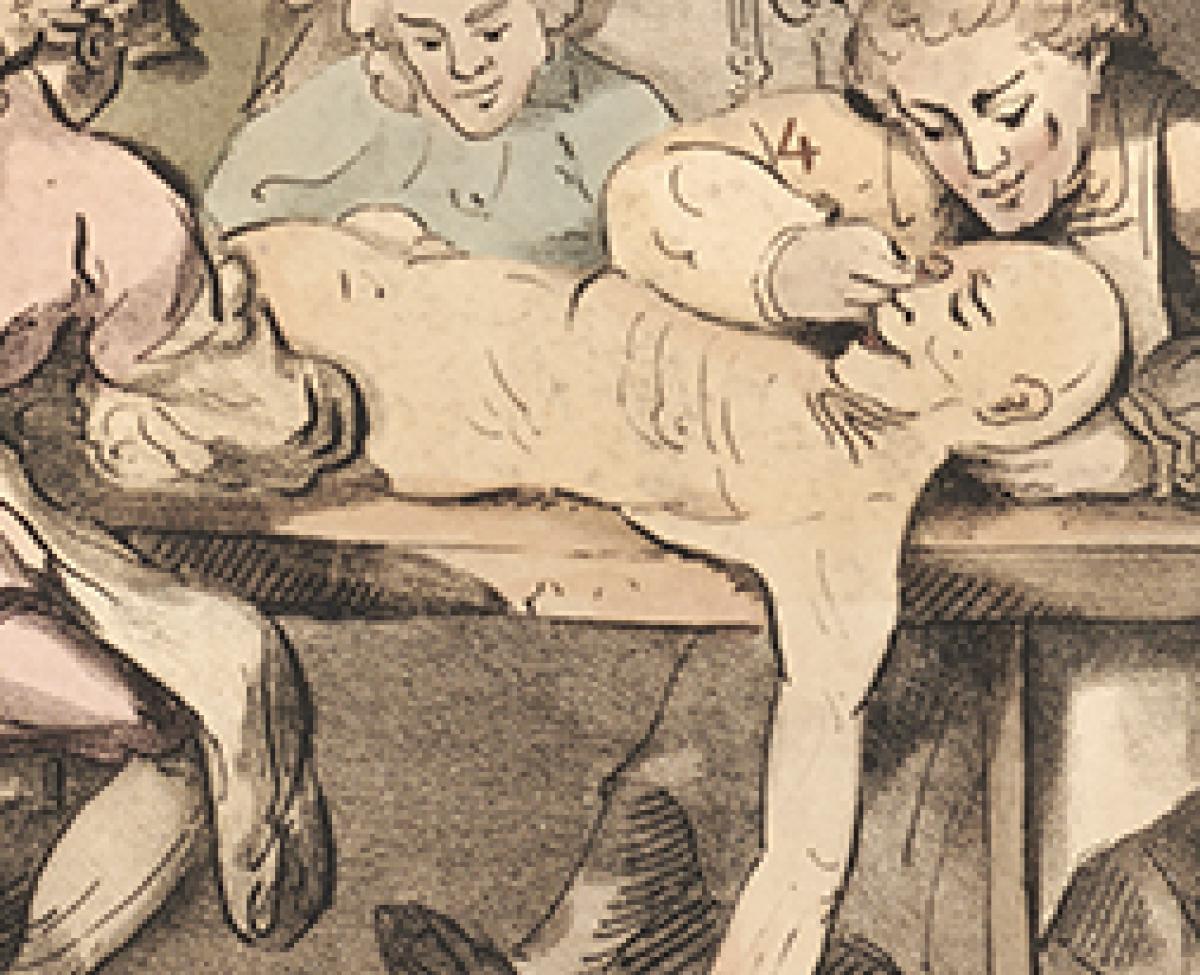A close up of a corpse's face in a satirical depiction of a dissecting room.