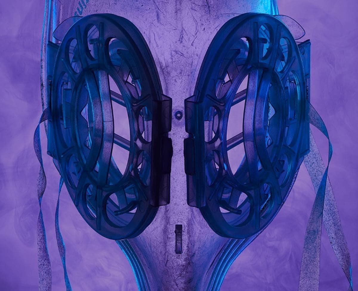Two dark blue ovals with a see-through shape behind, all on a purple smoky background