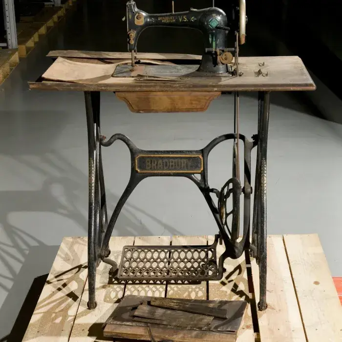 Treadle-operated sewing machine made by Bradbury & Company Limited, 1875-1900.