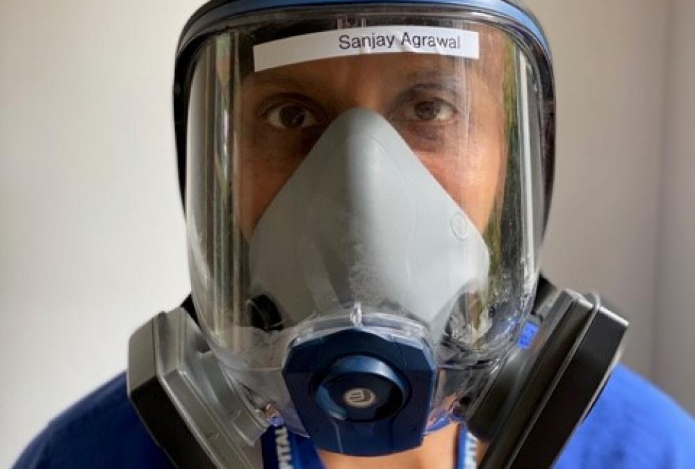 Doctor Sanjay wearing a respirator